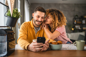 Happy couple have breakfast and cup of coffee at home morning routine