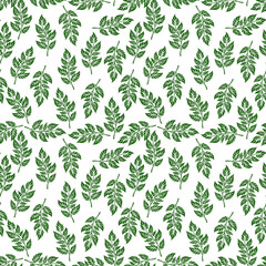 Seamless pattern of green leaves arranged uniformly on a white background