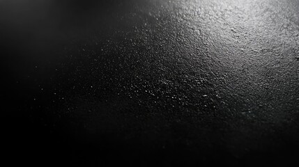 Obraz premium Close-up of a textured black surface with droplets, evoking a moody and atmospheric ambiance.