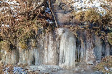 Icicles on a frozen rock wall