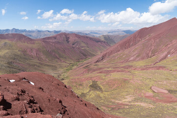 View of the colorful Rainbow Mountain (known as Vinicunca) and Red Valley located in Andes, Peru.