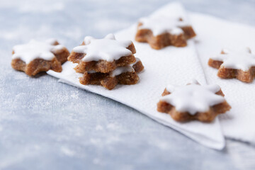 Christmas cookies (cinnamon stars) on bright background. Close up.