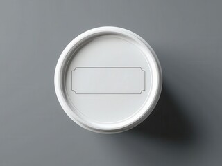 Fototapeta premium Minimalistic white container on a gray background, perfect for food packaging and branding.