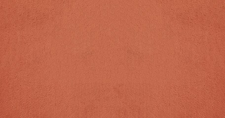 red pink plaster wall texture. Seamless surface abstract solid background Pale painted wall built structure textured stucco in terracotta color. seamless texture of plaster backdrop pattern Peach Fuzz