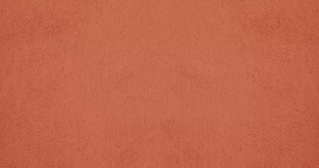Fototapeten Konkrete red pink plaster wall texture. Seamless surface abstract solid background Pale painted wall built structure textured stucco in terracotta color. seamless texture of plaster backdrop pattern Peach Fuzz  © Maxim Chuev