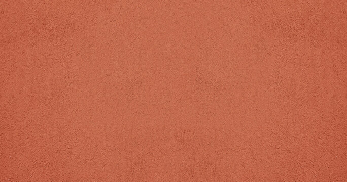 red pink plaster wall texture. Seamless surface abstract solid background Pale painted wall built structure textured stucco in terracotta color. seamless texture of plaster backdrop pattern Peach Fuzz