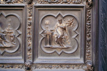 Ancient Bronze Door with Intricate Depictions