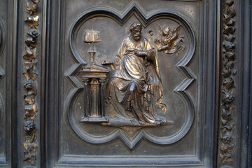 Ancient Bronze Door with Intricate Depictions