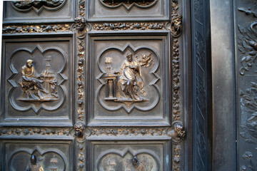 Ancient Bronze Door with Intricate Depictions