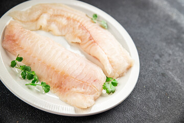 Raw fish fillet fresh tasty food dish delicious gourmet food background on the table rustic food top view copy space keto and paleo diet pescetarian