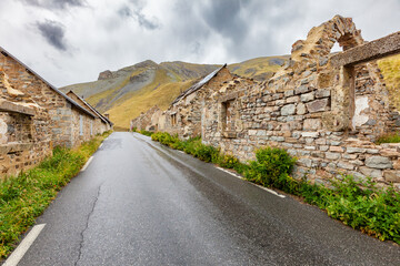 "Camp des Fourches", abandoned World War II army barracks, high altitude Alpine road crossing the camp, Mercantour National Park mountains, "Alpes-de-Haute-Provence", French Alps, Provence, France