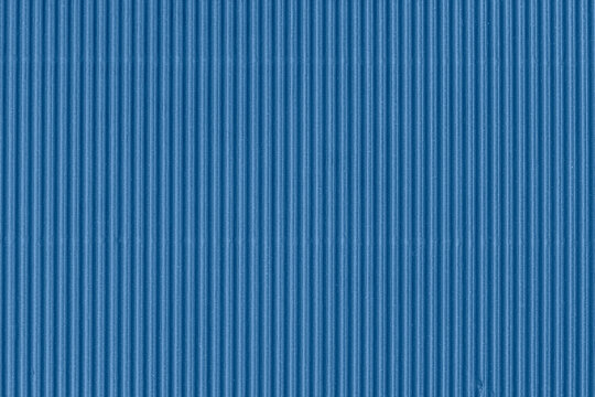Abstract background of blue ridges, textured striped pattern