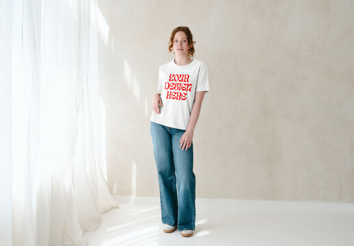 Mockup Of Woman Wearing Customizable T-Shirt In Studio