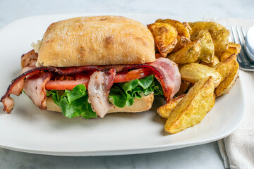ciabatta blt sandwiches with potato wedges,
