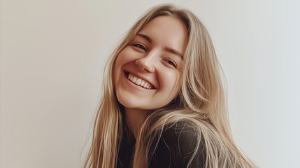Fototapeta premium Woman with blonde hair is smiling