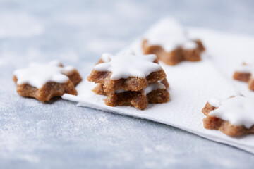 Christmas cookies (cinnamon stars) on bright background. Close up.