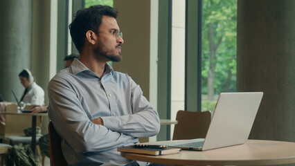 Angry man Arabian Indian male businessman freelancer employee business worker visitor cafe work online laptop computer displeased frustrated worried guy chatting read email deadline fail upset problem