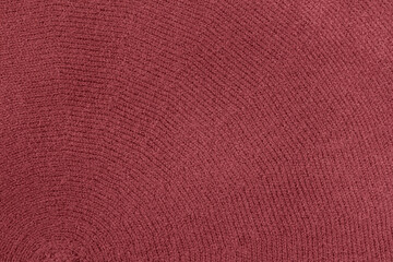 Maroon color knitted fabric, texture as background, trendy color