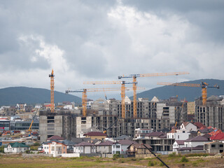 Novorossiysk many hoisting cranes and buildings under construction