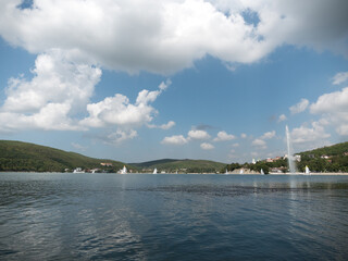 Abrau Durso, Russia 28 August 2024: Panoramic view of the lake Abrau-Durso with sailboats on a sunny day