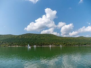 Abrau Durso, Russia 28 August 2024: Panoramic view of the lake Abrau-Durso with sailboats on a sunny day