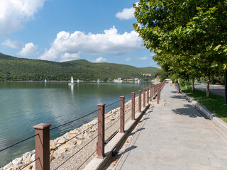 Abrau Durso, Russia 28 August 2024: Picturesque view of embankment of lake Abrau on sunny day in Abrau Durso
