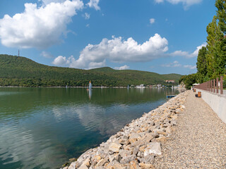 Abrau Durso, Russia 28 August 2024: Picturesque view of embankment of lake Abrau on sunny day in Abrau Durso