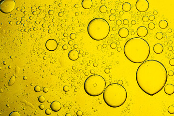 Macro close up yellow drink bubble texture,Fresh lemon slice in water with bubbles on white...