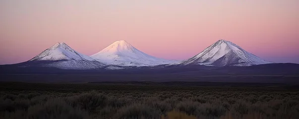 Fototapete Majestic Snow-Capped Volcanoes Serene Landscape with Symmetrical Peaks in Muted Pastels and Soft Light - Ideal for Travel and Nature Themes © Artful Stock