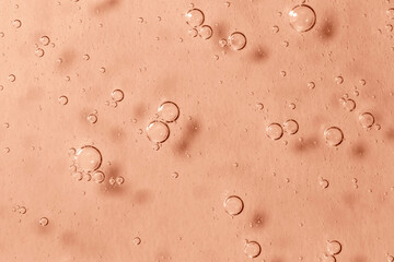 Light Mocha brown textured gel background with big bubbles close up. Concept of cosmetic, medical and other laboratory research. Selective focus. Demonstrating color of 2025 year
