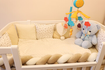 A crib covered with toys. Comfort for a child's life and rest.