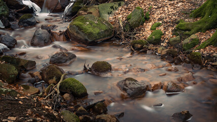 winding stream photographed with slow shutter speed