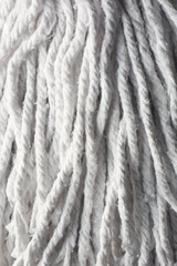 close-up of soft absorbent fiber mop head abstract background, tool for cleaning floors and other surfaces