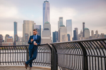 Business man outdoor portrait. Middle age businessman in NYC street. Mature age, mid adult man in 40s walk at Manhattan. Business portrait Hispanic business man. Outside business and office concept.