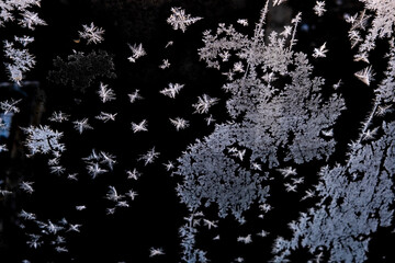 Frosty patterns on the glass. Frost on the glass.