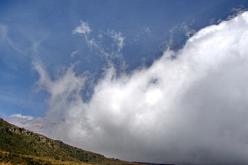 Fototapeta premium Dense cloud bank covering Cotopaxi Volcano, in Cotopaxi National Park, outside of Quito, Ecuador
