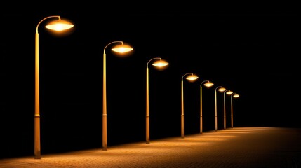 A row of street lights are lit up in the dark