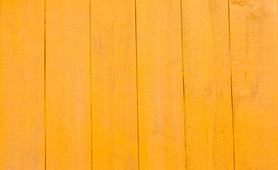 Yellow wooden background with cracks and scratches in vintage style. Abstract background and texture for design