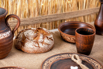 Christmas table with traditional bread and pottery decor