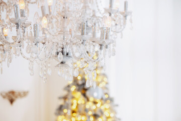 Enjoy Christmas with a festive tree and elegant chandelier