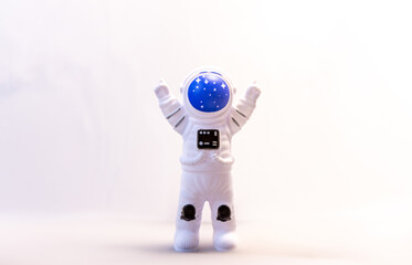 An Astronaut Celebrates With Their Arms In The Air