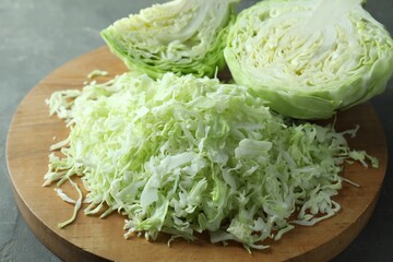 Fresh shredded cabbage on grey table, closeup