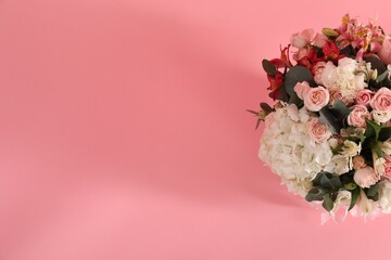 Bouquet of beautiful flowers on pink background, top view. Space for text
