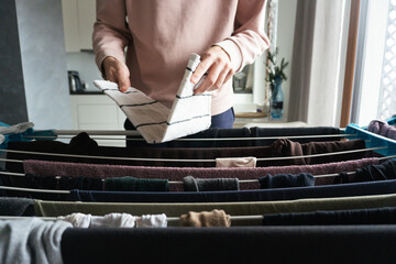 Woman Holding Folded Kitchen Towel