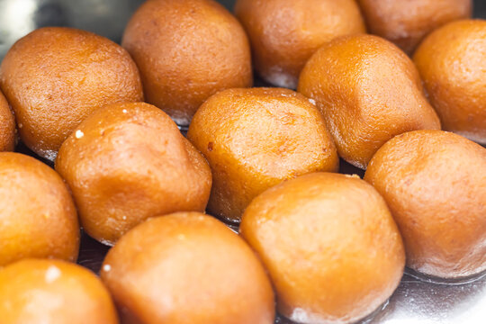 Lalmohan, Lal Mohan or Gulab Jamun texture closeup side view of Indian, pakistani and bangladeshi sweet dessert food
