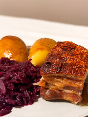 Norwegian Christmas Dinner - Ribbe Pork Plate with potatoes, red cabbage and brown sauce