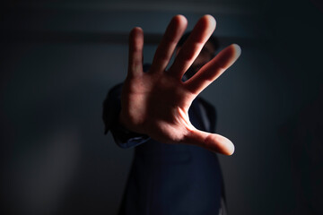 man in suit showing stop hand