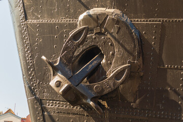 Close-up of a ship's bow with a mounted anchor