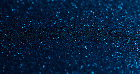 Blurred sparkling. Blue powder. Flare shimmering festive surface with fine metallic dust. Glamour starry particles texture effect.