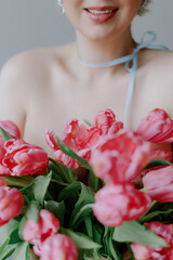 Portrait Featuring a Woman Surrounded by Beautiful Pink Tulips Blossoming